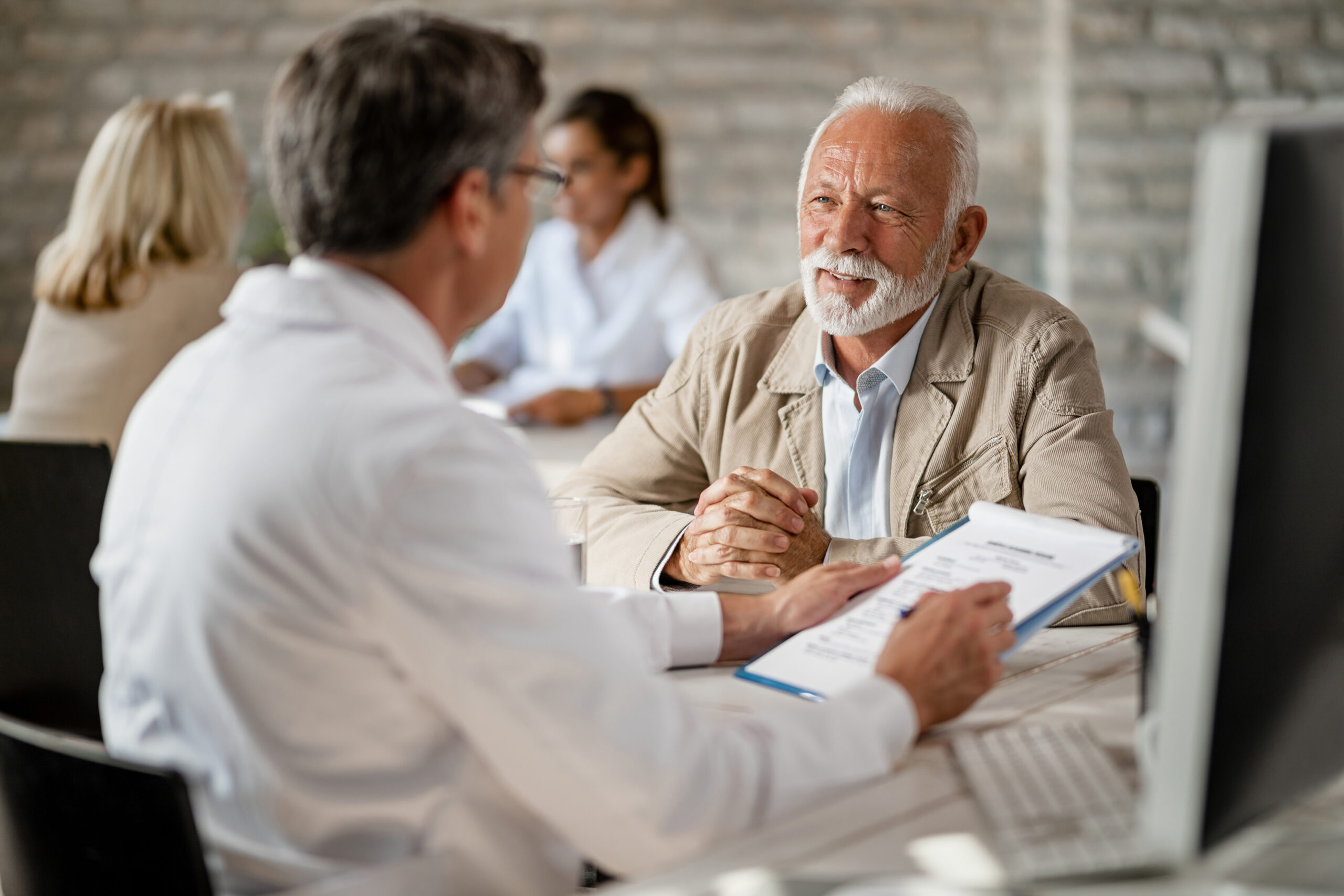 Patient reviewing home health care insurance coverage with provider — Innovation Home Health Florida