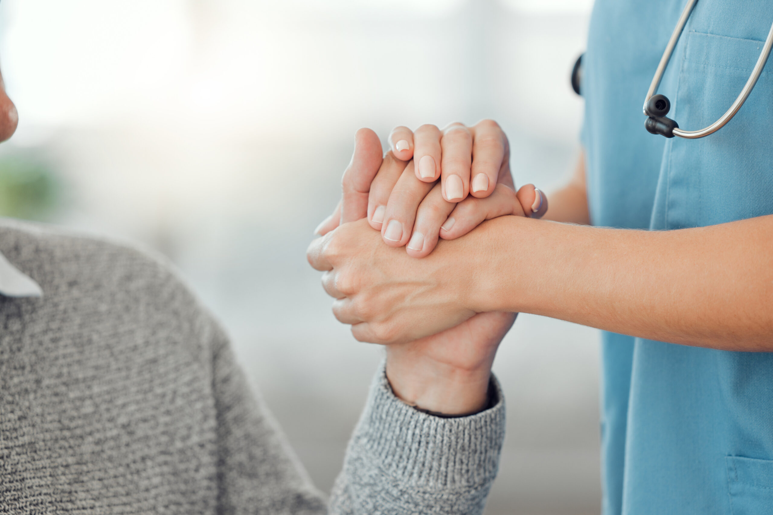 Caregiver providing home health support to elderly patient in Miami-Dade County